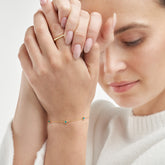 14k Yellow Gold Enamel Star Station Bracelet on woman's wrist